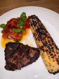 Grilled Fillet Mignon with grilled corn and roasted garlic tomatoes 🍅