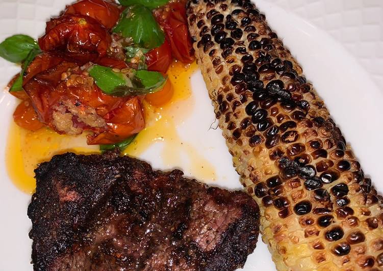 Grilled Fillet Mignon with grilled corn and roasted garlic tomatoes ?