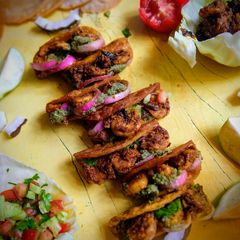 A picture of Ghee Roast Prawn Tacos.