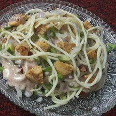 A picture of Spicy noodle salad with tikka chunks.