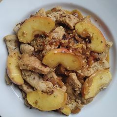 A picture of Pork with apple and onion.