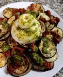 Berenjena asada con burrata, pesto y tomate seco