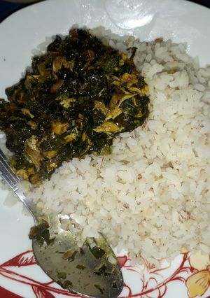 A picture of Ofada rice with vegetable soup.