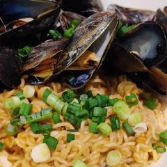 A picture of Spicy Peanut Butter Ramen with Mussels.