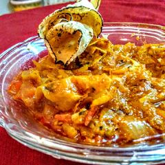 A picture of Rajathani papad ki sabji (onion, tomato curry).