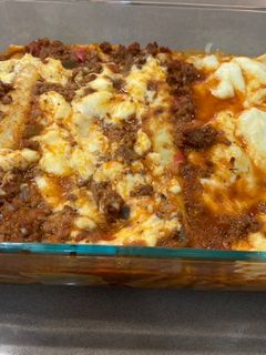 Una foto de Canelones de acelga con salsa bolognesa y salsa blanca