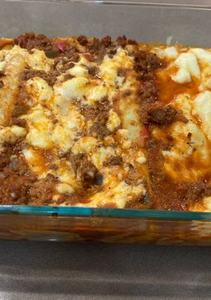 Una foto de Canelones de acelga con salsa bolognesa y salsa blanca