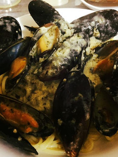 A picture of Pasta with Mussels in a garlic butter cream sauce.