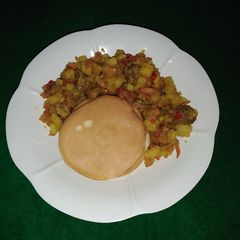 A picture of Pancakes and beef potato sauce.