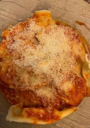 A picture of Mezzelune Ravioli with Ricotta, Speck, and Walnuts.