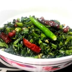 A picture of Kolmi shaag bhaaja (Water Spinach stir fried).