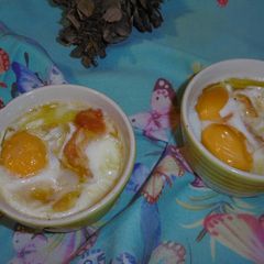 A picture of Baked Eggs, Tomatoes & Smoked Scamorza Cheese.