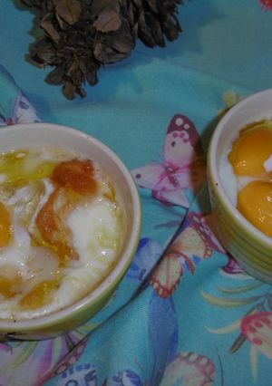 A picture of Baked Eggs, Tomatoes & Smoked Scamorza Cheese.