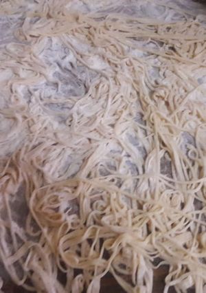 Una foto de Fideos caseros con salsa