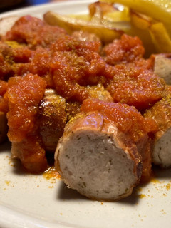 Una foto de Currywurst