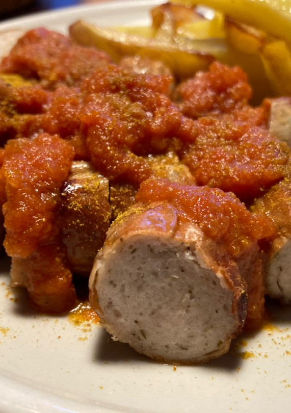 Una foto de Currywurst