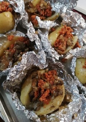 A picture of Baked Potatoes Stuffed with Mushrooms, Chorizo, and Chipotle Cream.