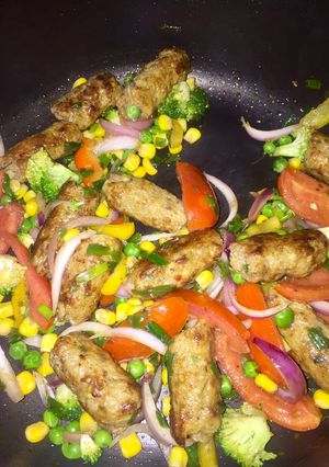 A picture of Chicken seekh kabab with vegetables.