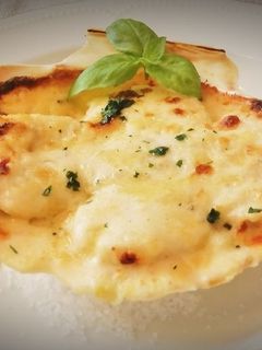 Una foto de Vieiras gratinadas