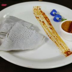 A picture of Butterfly pea urad dal dosa.