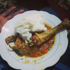 Chicken stew and ugali A picture of Chicken stew and ugali.