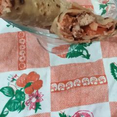 A picture of Orange chicken tikka paratha roll.