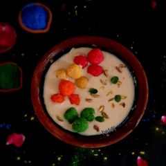 A picture of Rabdi with colourful coconut ladoo.