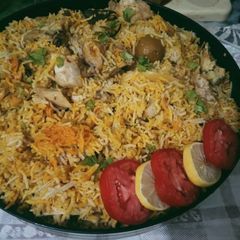 A picture of Chicken Achari biryani.