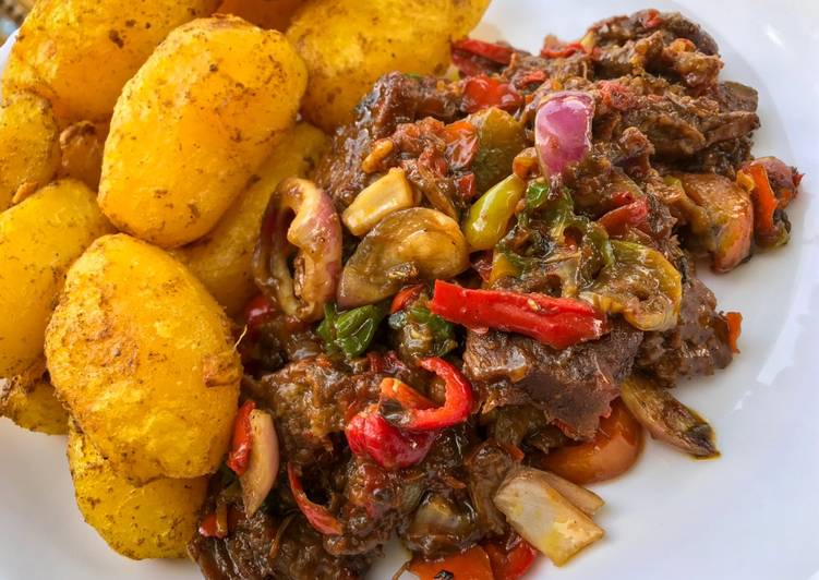 Baked irish potatoes and beef sauce