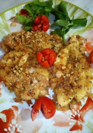 Foto di Fette di petto di pollo,panate con dadolata, di zucca, patate, e pan grattato, gratinati in forno