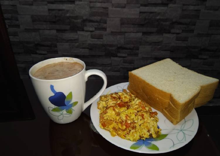 Scrambled eggs, bread and sausage beverage