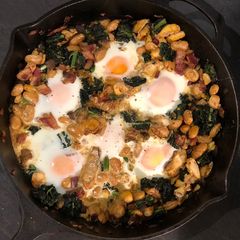 Smoked haddock, kale and butterbean baked eggs A picture of Smoked haddock, kale and butterbean baked eggs.