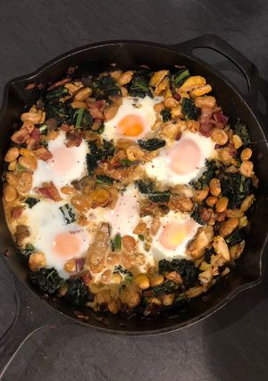 A picture of Smoked haddock, kale and butterbean baked eggs.