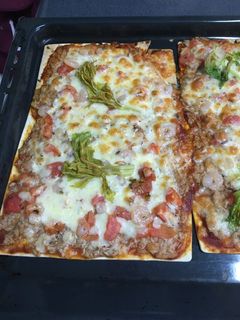 Una foto de Pizza de atún