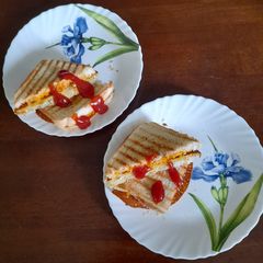 A picture of Sandwich with Cheese Spread and Besan Chilla.