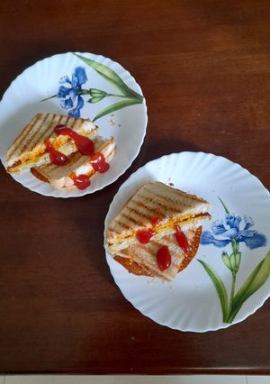 A picture of Sandwich with Cheese Spread and Besan Chilla.