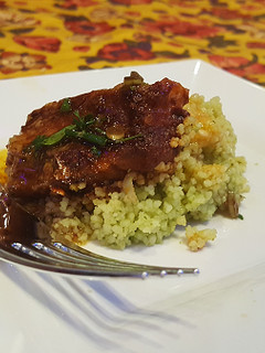 A picture of Summer couscous and heirloom tomato vinaigrette.