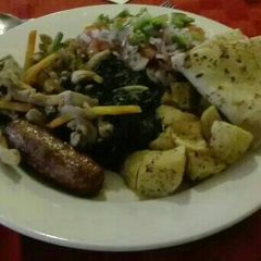 A picture of African breakfast sausages, pancakes, salad with kachumbari.