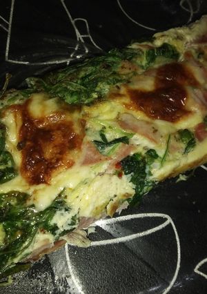 Una foto de Budín de rúcula, jamón y queso