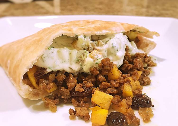 Step-by-Step Guide to Curried beef pitas with cucumber sauce