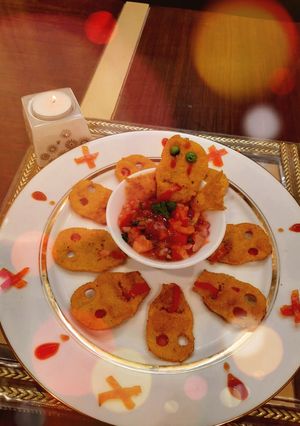 A picture of Spooky Nachos With Bloody Salsa.