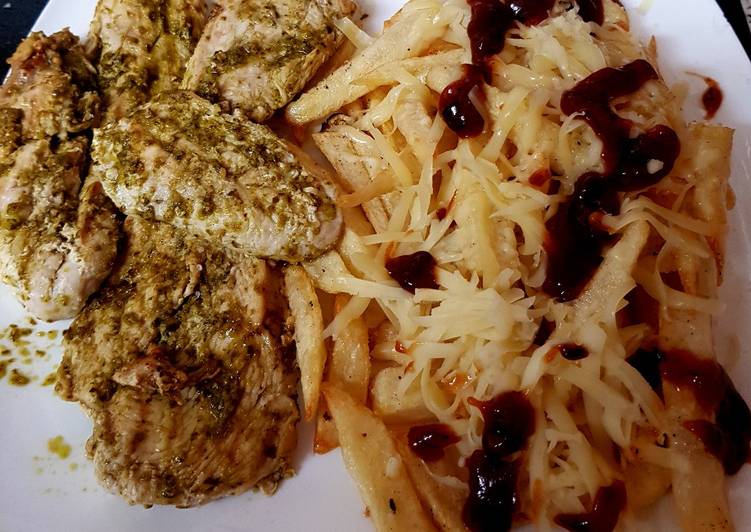 My Grilled Chicken with Pesto sauce and cheesy chips. π