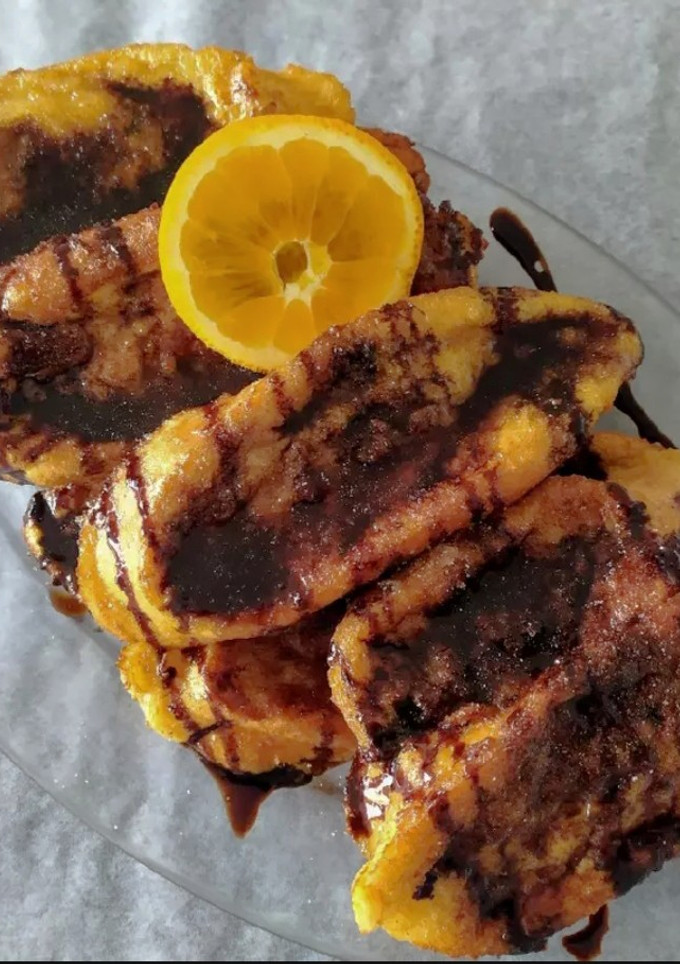 Una foto de Torrijas Caseras con naranja y chocolate