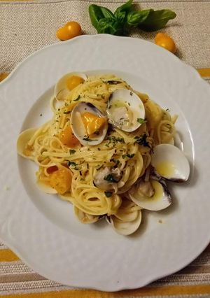 A picture of Linguine with Clams and Yellow Tomato Cream, Topped with Dried Basil.