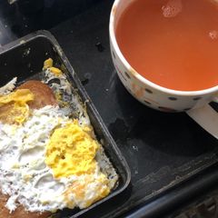 A picture of Tomato soup and Fried Egg -Bread.