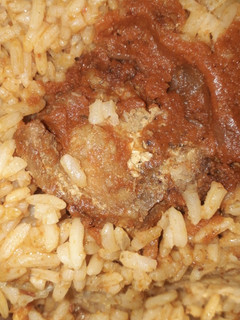 A picture of Jollof rice and chicken.