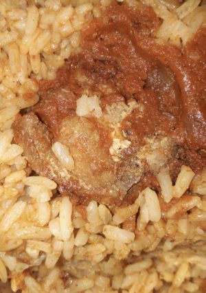 A picture of Jollof rice and chicken.