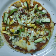 A picture of Exotic Italian Veggies cum Punjabi gravy Pizza.