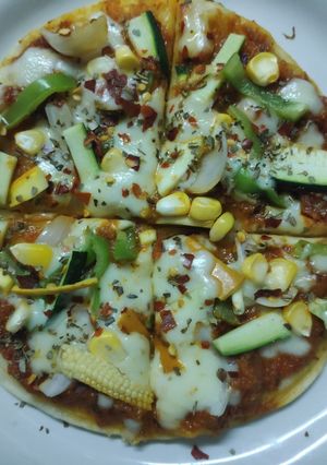 A picture of Exotic Italian Veggies cum Punjabi gravy Pizza.