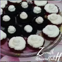 A picture of Jello Cupcakes with Whipped Cream.